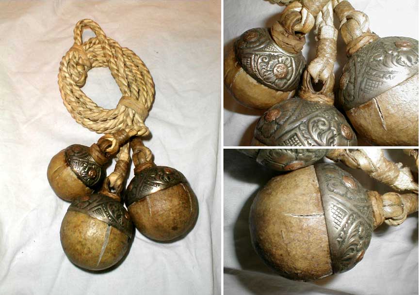 bola or boleadoras from argentina with silver and copper caps